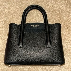 Very good condition. Black Kate Spade purse with shoulder strap.